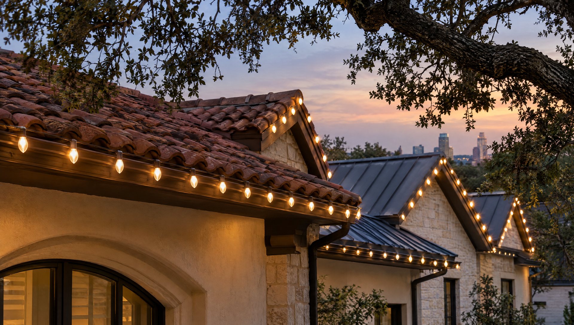 Warm white bulbs clipped along a clay tile roof and a metal roof edge at dusk