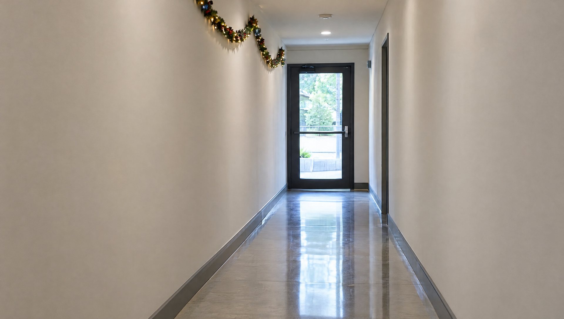 Office corridor with Christmas decor kept off the clear, unobstructed exit door and path
