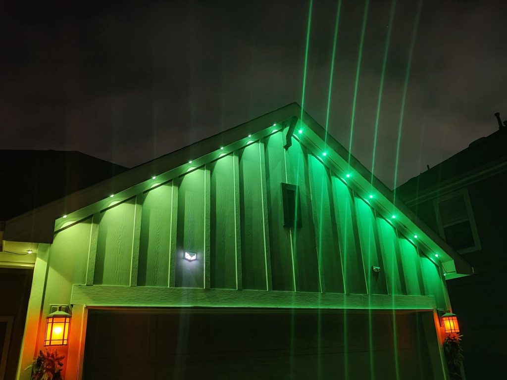 Gable and garage lit green by permanent eave lights