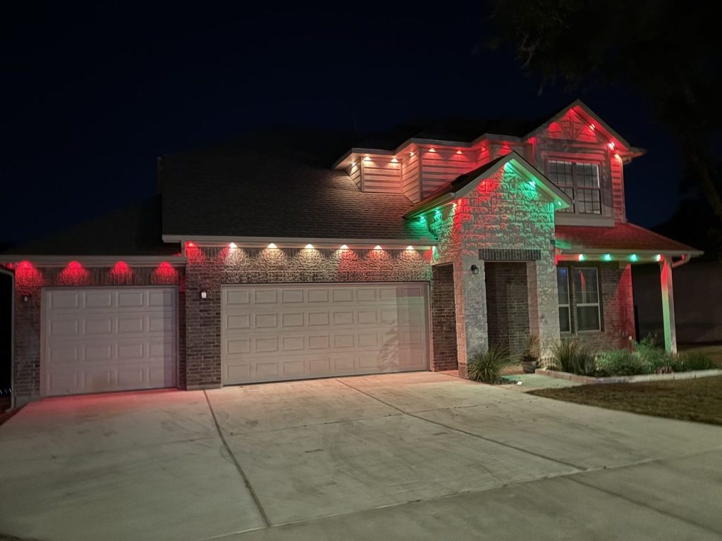 Brick and stone two-story home with permanent lights in red and green