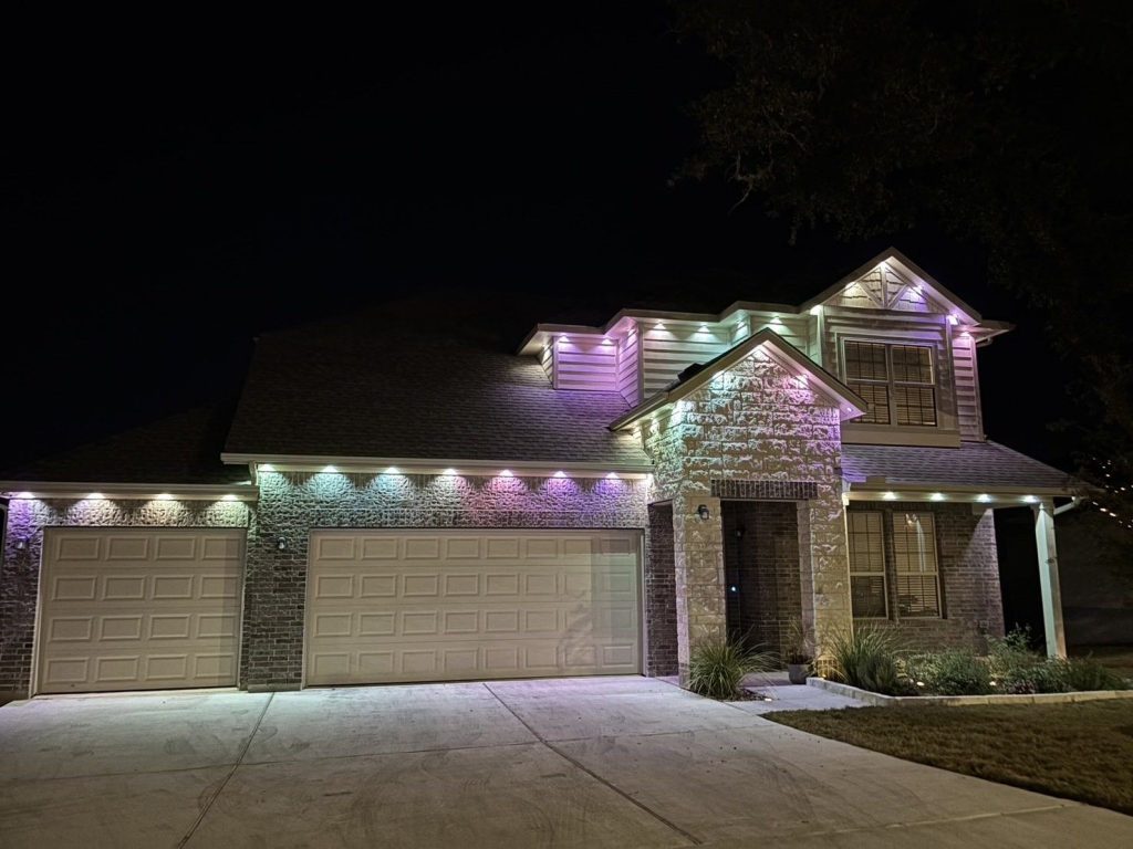Two-story home with permanent lights in soft white and pastel tones